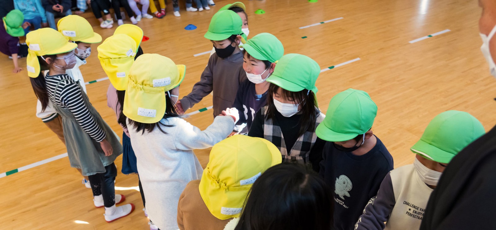 Shaking hands after the game. Sometimes, children on the losing side begin to cry, but they are consoled by friends.